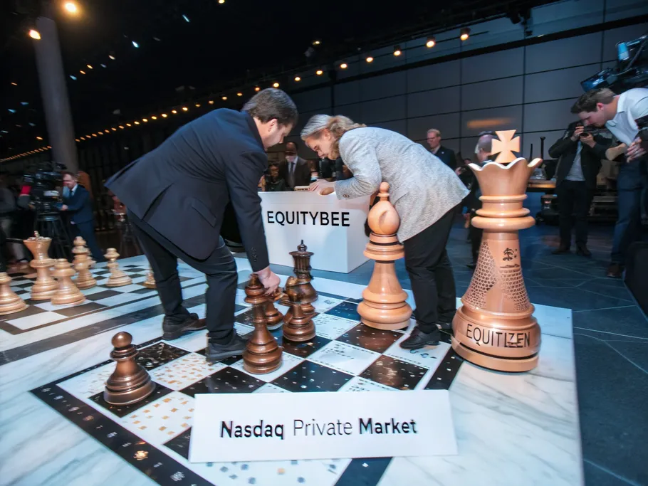 Overhead shot of a chess board with fintech companies represented as chess pieces in a strategic setup.