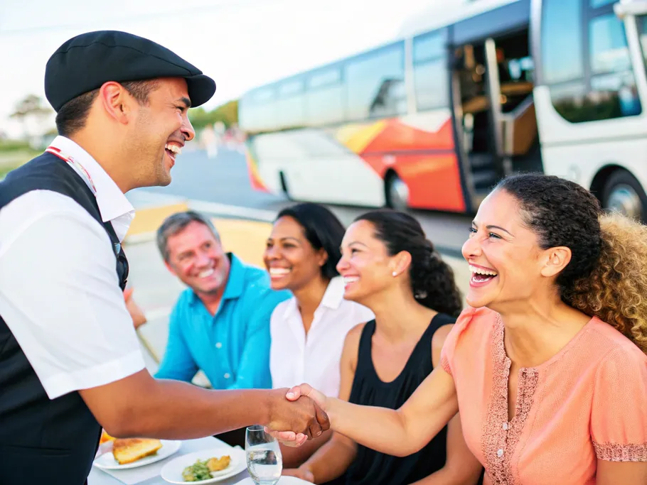 A service professional shakes hands with a satisfied customer, symbolizing trust and positive experiences.